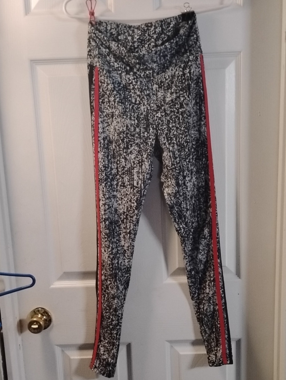 No Boundaries Black and White Marbled Leggings with Red And Black Side Stripes.